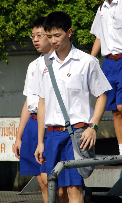 Thai schoolboys boarding the ferry