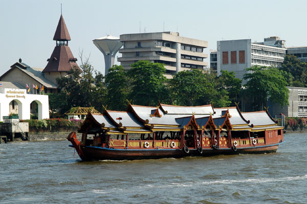 River tour boat passing Thammasat University