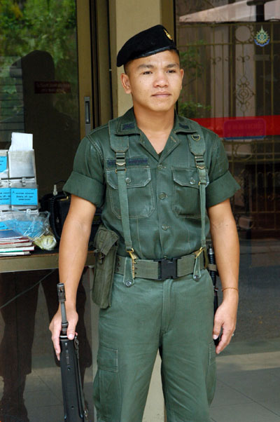 Thai soldier guarding the Teak Palace, Bangkok