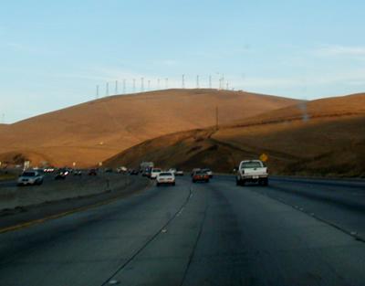 Wind farm in the Altamont Pass, East of Livermore, taken through the windshield while driving East on I-580.