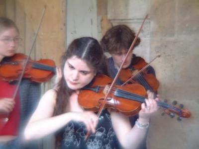 9 violins were playing together on Place des Vosges - Sept 2004