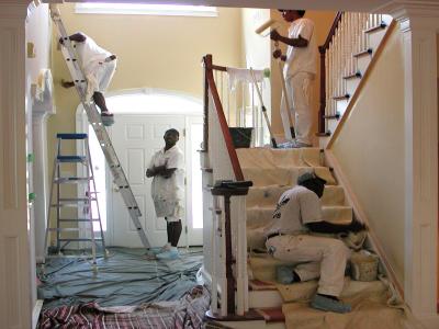 Painters recoat the walls and touch up the trim