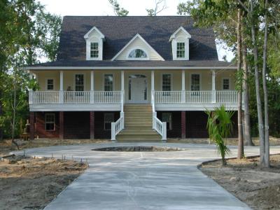 The driveway cement cures as work inside nears completion 08/23/2002