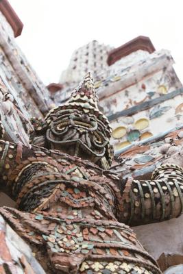 Statue Holding Up Wat Arun Chedi, Bangkok