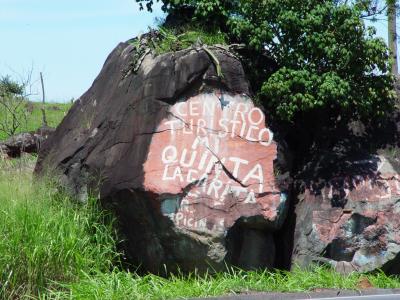 Carved into... mmm... painted in the stone by Carlos Chacon