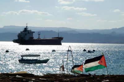 Freighter anchored off Aqaba, Egypt's Sinai Peninsula in the background