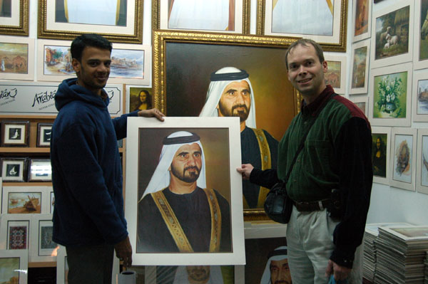 Roy purchasing a Sheikh Mohammed print in the Singapore pavilion