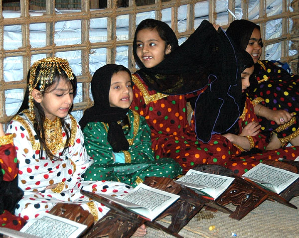 Girls reading the Koran, Heritage Village