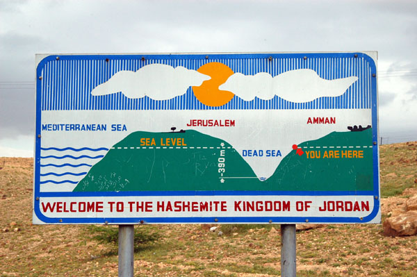 A sign showing the Dead Sea in relation to Amman and Jerusalem