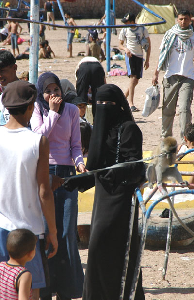 Veiled woman on the beach in Aqaba