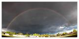 Rainbow Pano in very dark clouds