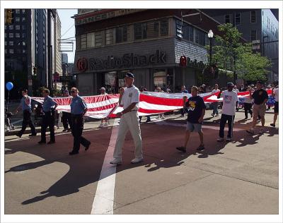 Flag front and center at Labor Day Parade.