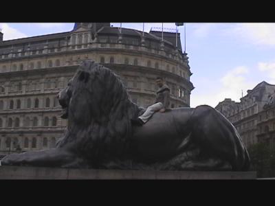 Riding the Lion at Trafalgar Square.  Usually covered in people but Clint managed to fight them off.