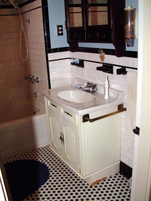 Old Sears sink.  We think it was installed around 1970.  Note the hexagonal floor.