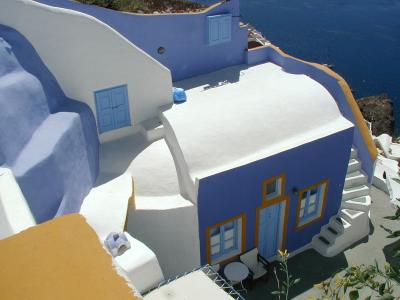 3 - A blue and ochre painted house front in Oia