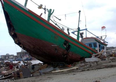 Asian tsunami: large boat sits among the rubble