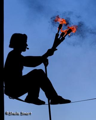 Silhouette of juggler with fire