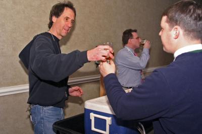 Ed Bielaus passing on a sample of one of his brews.