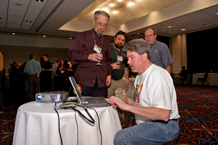 Paul Langlie watches Spirit of Belgium organizer Rick Garvin set up a presentation on Belgium and Belgian beers.