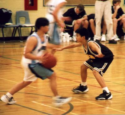 Michael in a highschool basketball match, 2001
