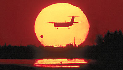 Landing at sunset aviation stock photo #SS9932L