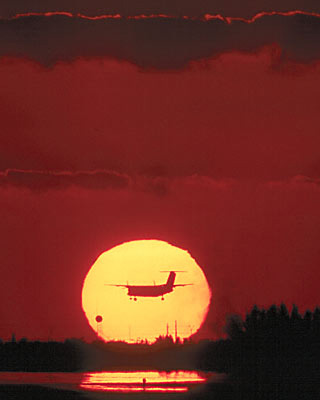 Sunset Skies and Prop Aircraft Stock Photos