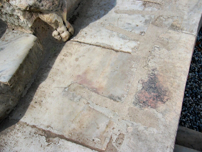 Marble seats, with lions paws<br>marking end of a row