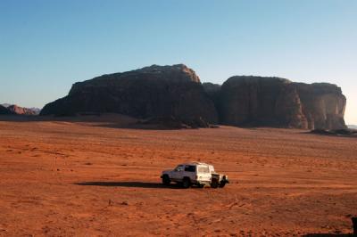 A pair of jeeps in front of Khazali Wadi Rum