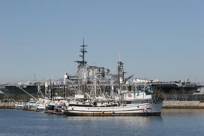 Fishing Boats And The USS Midway