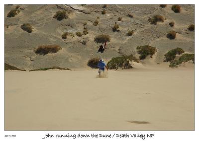 John running down the dune