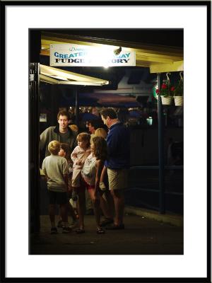 People gather at the fudge shop.