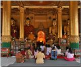 Worshipers in a temple at the Shwedagon Pagoda