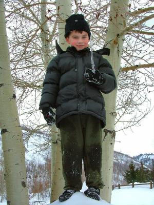 rather sinister looking son holding mighty sharp icicle!