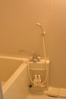 You actually sit on a little stool (see next picture). This was the same type of set up for the public bath.