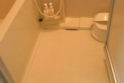Little stool in the right hand corner; you sit on it and shower.