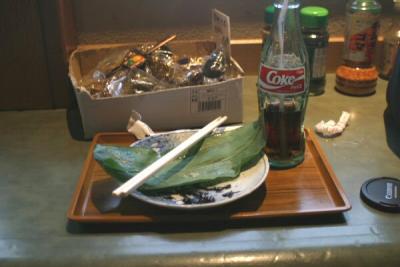It was a kind of rice cake thing that was wrapped in this leaf.  I had this at the top of Hasedera (The Hase Kannon Temple) in Kamakura.  I have pictures in another gallery if you're interested in the Temple.

That box of stuff there was just sitting there.  I did not eat that.  :-P