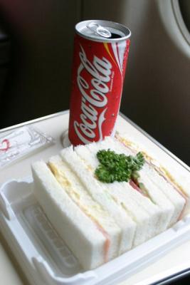 Similar to a club, but with egg salad, some type of meat, and something else.  I generally didn't ask what I was eating and as long as I didn't get 100% repulsed by the taste or texture, I ate it.