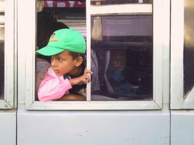 Peeking thru the window of a bus (at a roadside bus terminal at Kathmadu)