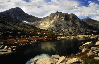 Reflection in an alpine pond by Shelby Frisch