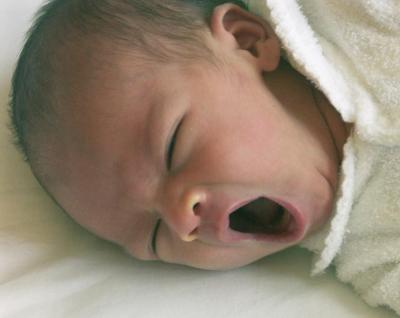 Seven-day-old baby, big yawn