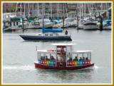 Aquabus - passenger ferry crosses False Creek.