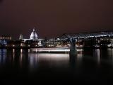 Londons Millenium Bridge and St Pauls, cruise ship sailing past.