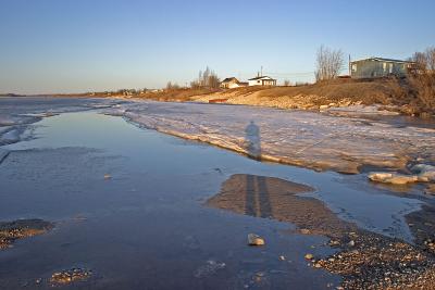 Photographer's shadow along shoreline