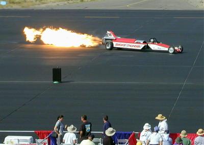 Smoke and Thunder, a jet-powered dragster, races from a standing start (and sometimes beats) airplanes which are already in flight when they cross the start line.