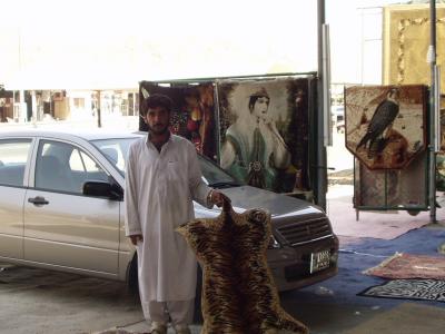 The guy who sold me my rugs. I paid way too much for my rugs. That's my car behind him.It's a Mitsubishi