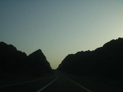 The road through the mountains, at dusk, headed home.
