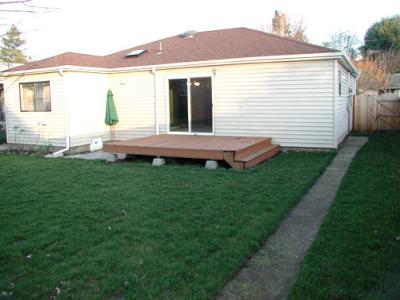 Large Fenced Backyard with Deck