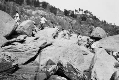 China 1906 Trackers-climbing-boulders