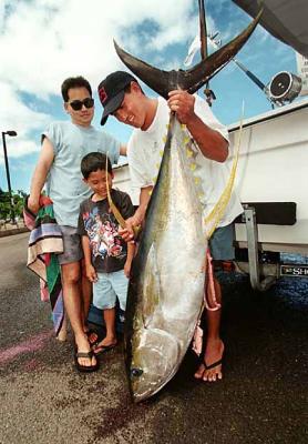 CSAs Kevin & Kanekoa and son Koa with a Big Catch of the Day make the front page of the HNL Star Bulletin Newspaper