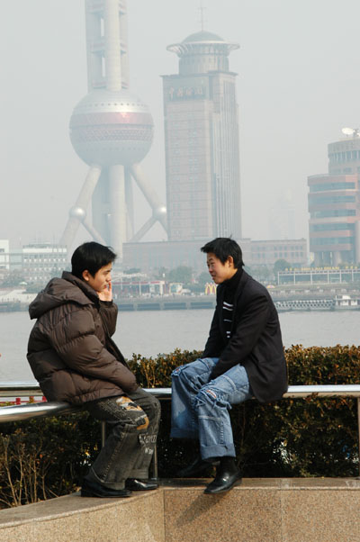 Chinese guys along the Huangpu River